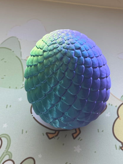 Baby dragon in an egg