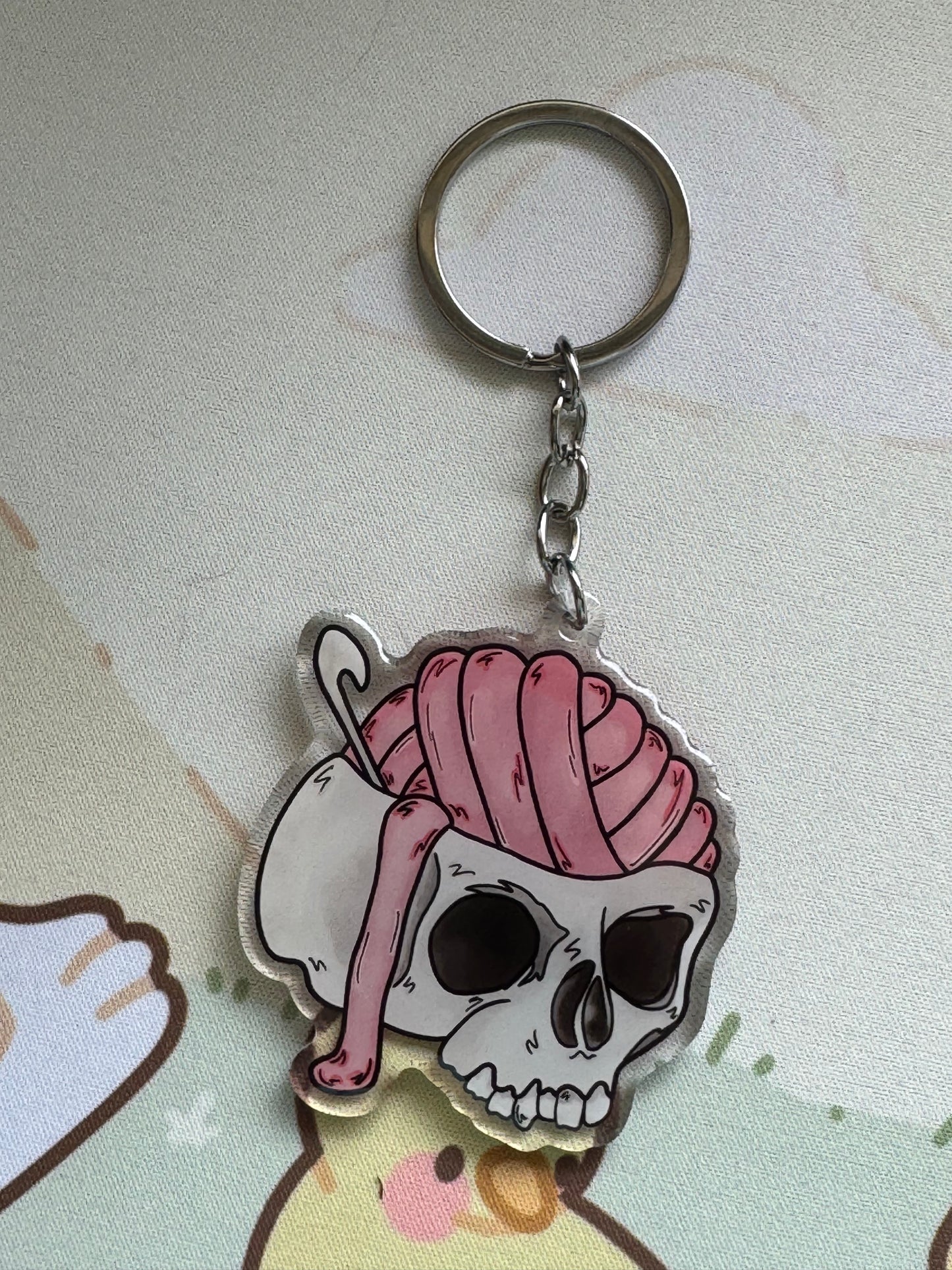 Skull with yarn brains keyring