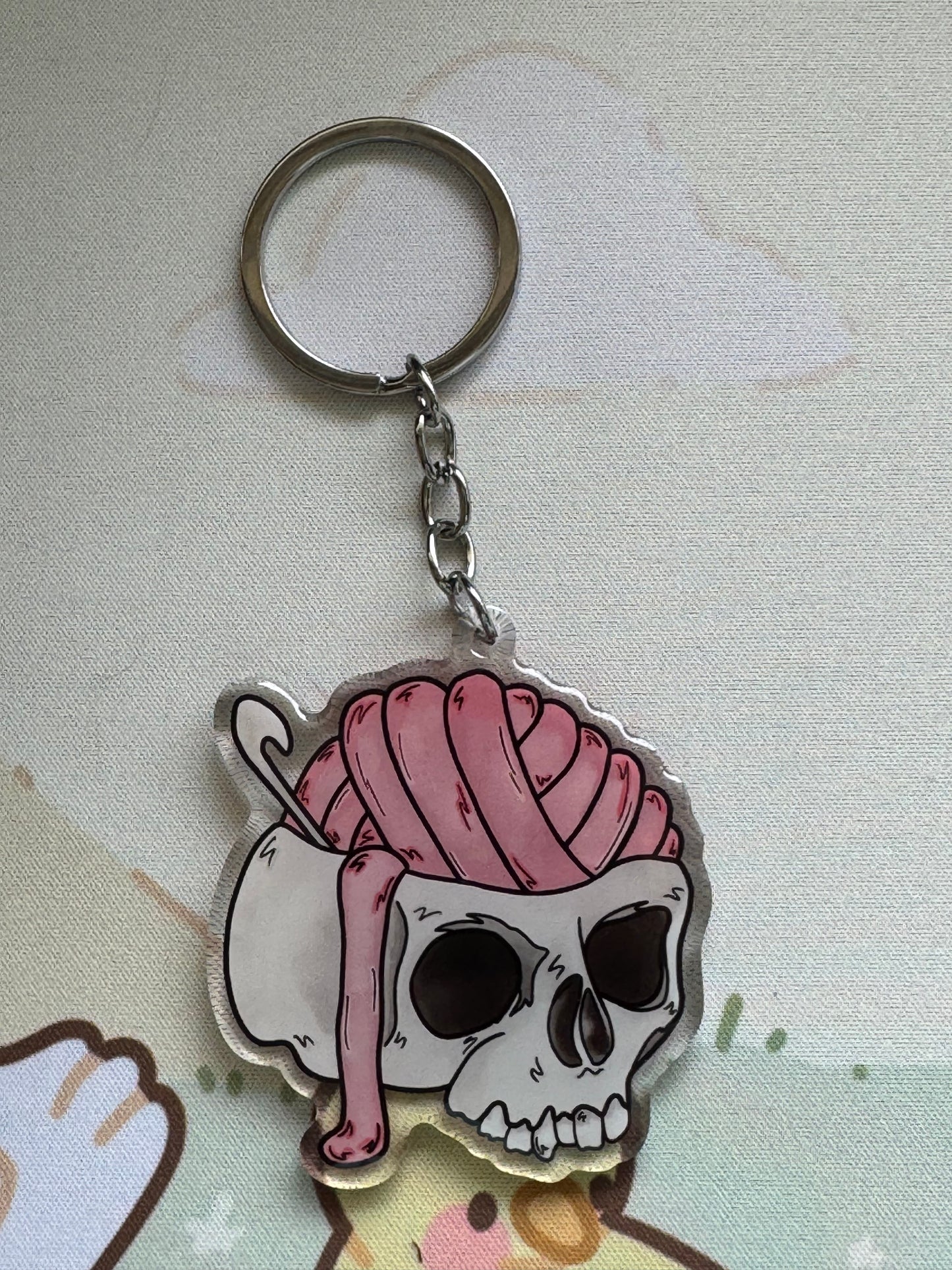 Skull with yarn brains keyring